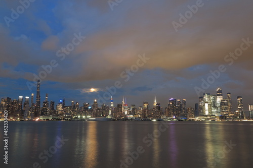Beautiful Manhattan night view and moon seen from New Jersey © funbox