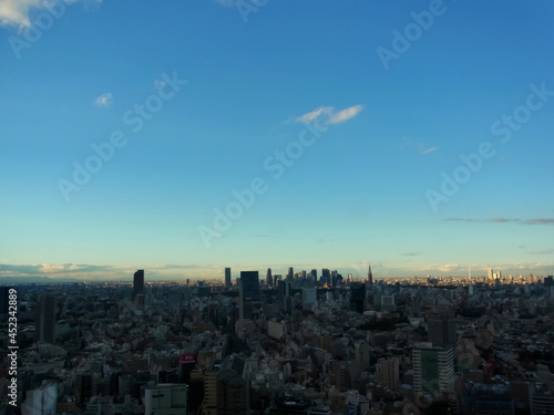 Urban building group and the blue sky which are surrounded in darkness