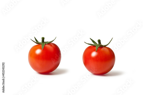 Pair of Red Cherry Tomatoes with Leaves, Ingredient – Italian "Ciliegino" Variety – Isolated on White Background