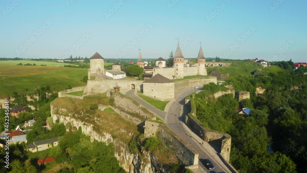 Aerial view of the ruins of a large medieval castle in Europe. Well preserved 500 years old castle. Aerial view of the ruins of a large medieval castle in Europe. Well preserved 500 years old castle.