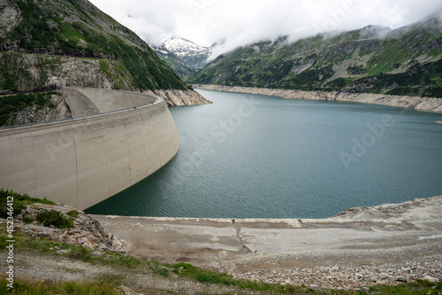 Fototapeta Naklejka Na Ścianę i Meble -  Maltastaudamm and Kolbreinspeicher. Carinthia. Austria. Dam and Reservoir of a Hydroelectric Powerplant in Stunning Alpine Landscape