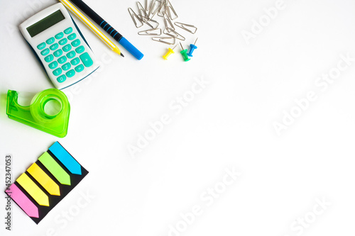 Office supplies on a white background, flat lay, copy space