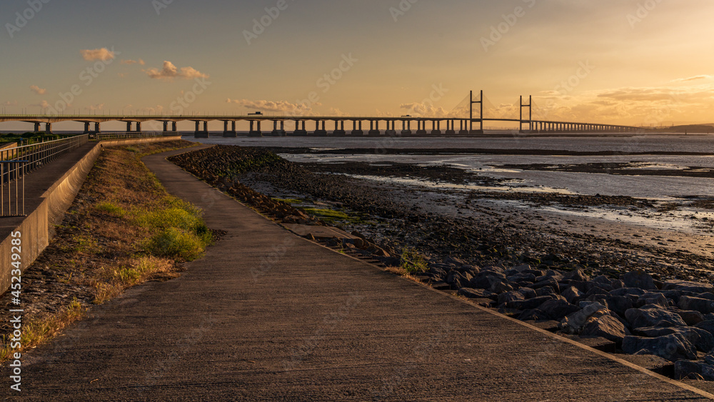 Golden Hour at the The Prince of Wales Bridge and the River Severn, seen from Redwick, South Gloucestershire, England, UK