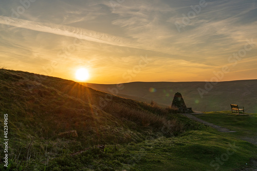 Sunset and a bench with a view, seen at the Buttertubs Pass (Cliff Gate Rd) near Thwaite, North Yorkshire, England, UK