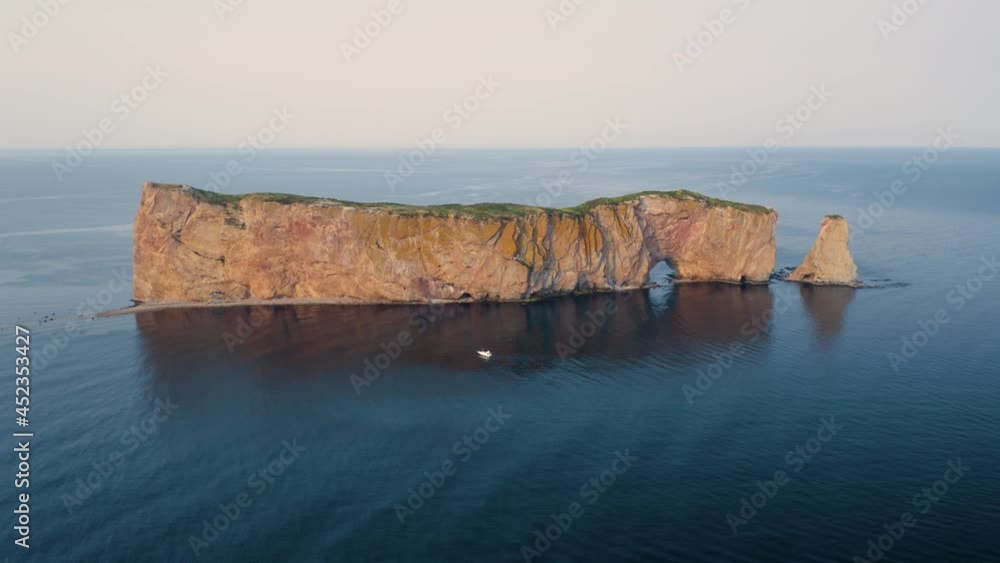 Aerial view of the Rocher Percé in the city of Percé in Quebec, Canada, at sunset, from drone Aerial view of the Rocher Percé in the city of Percé in Quebec, Canada, at sunset, from drone