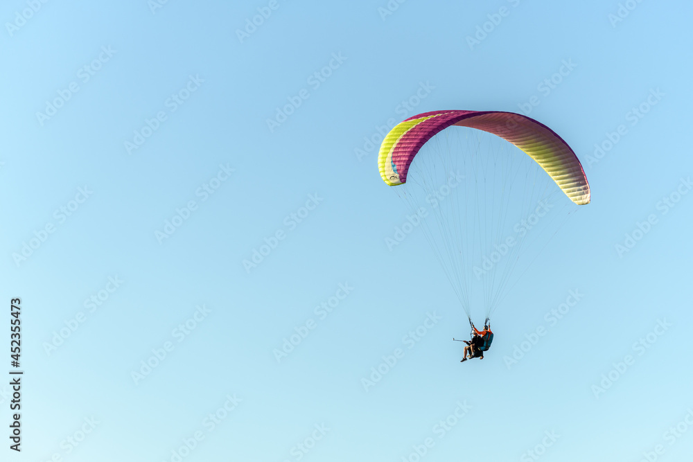 Paragliding flight in the air over the mountains. Paragliding flight in the air over the mountains.