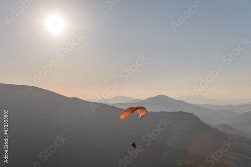 Paragliding flight in the air over the mountains. © bios48