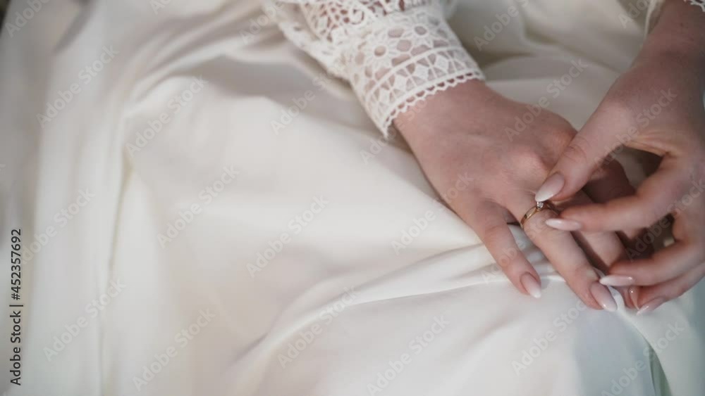 the bride adjusts the ring on her hand the bride adjusts the ring on her hand