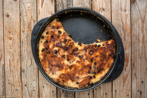 Just baked cake on wooden table 