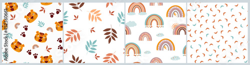 A set of seamless children's pattern with funny tiger faces, different emotions, paw prints, leaves, rainbows, arches, clouds. Print for baby clothes, textiles, fabrics. Vector graphics.
