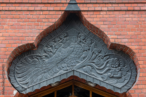 Decorative panel with the bird of paradise Sirin over the entrance to the Pertsova mansion photo