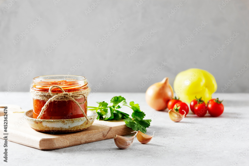 Authentic Spanish Sofrito sauce made with tomato, peppers, onion, garlic, herbs and olive oil in