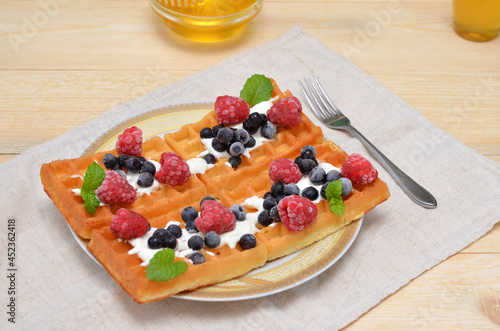 dessert fresh waffles with berries on a plate