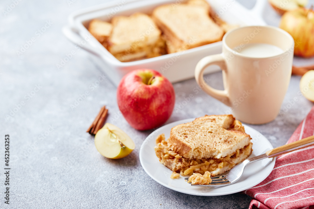 Bread pudding breakfast casserole made from wheat bread, eggs, milk and grated apples Bread pudding breakfast casserole made from wheat bread, eggs, milk and grated apples