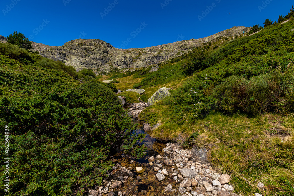 A fresh water stream from the  Peñalara mountains, the northern Mountain range of Madrid. Here you can taste pure water and refresh yourself during a hike in the hills