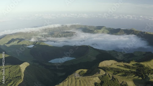 Aerial view of Lagoa das Eguas, a small lake on hilltop at sunset on Sao Miguel Island, Azores island, Portugal. photo