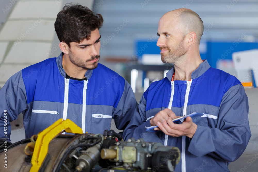 Fototapeta premium beaming workers having job at airdrome