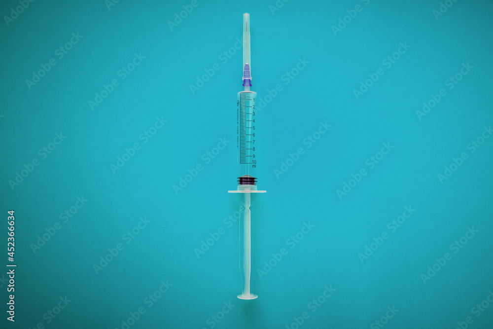 syringe. syringe on blue background syringe. syringe on blue background