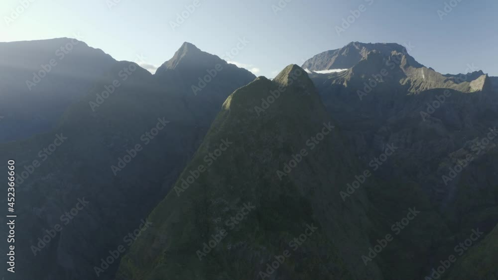 Aerial view of a mountain range with high peaks during a beautiful sunny day on Azores islands, Portugal. Aerial view of a mountain range with high peaks during a beautiful sunny day on Azores islands, Portugal.