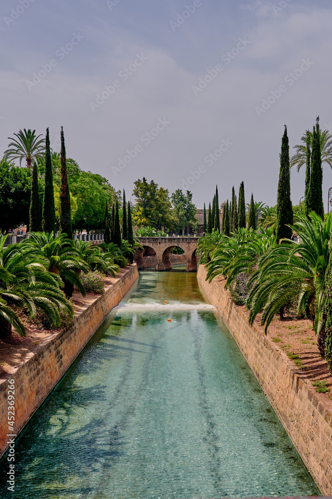 Obraz premium Canal Torrent de Sa Riera in the street Paseo de Mallorca in the center of Palma de Mallorca, Balearic Islands, Spain