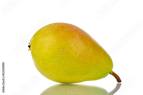 One bright yellow juicy pear, close-up, isolated on white.