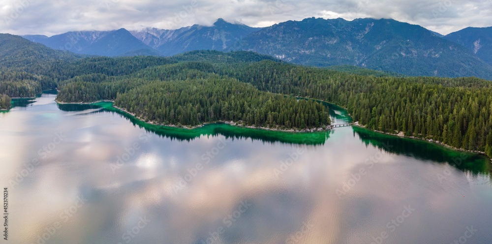 View to the Bavarian Lake Eibsee lake during summer with pure turquoise and clear water