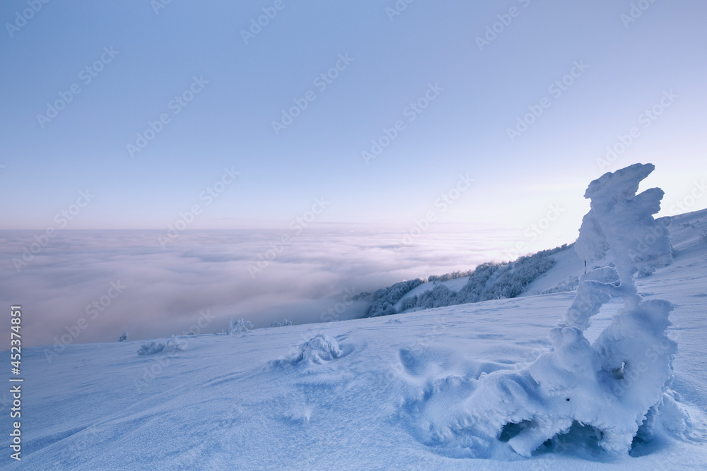 Dawn on snowy peaks after a blizzard