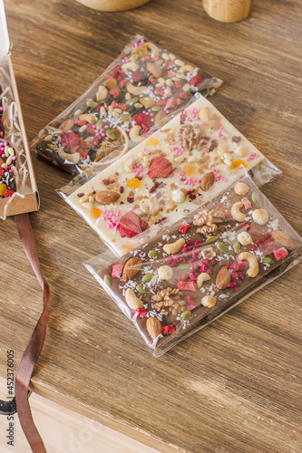 chocolate decorated with nuts, freeze-dried berries