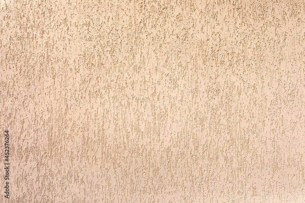 Fototapeta premium Plastered facade wall of the house. Decorative coating.