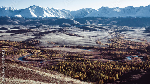 View of the snowy mountains and steppe in the foothills of the Altai Republic, Russia. photo