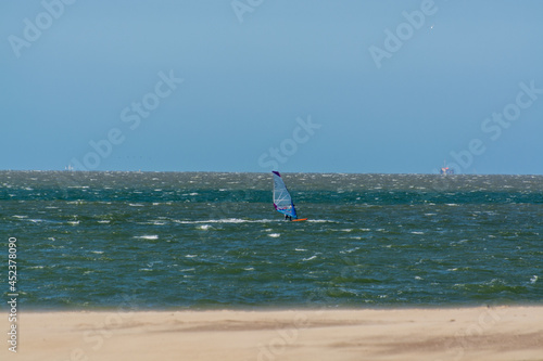 View on wide white sandy North sea beach in Renesse, Zeeland, Netherlands