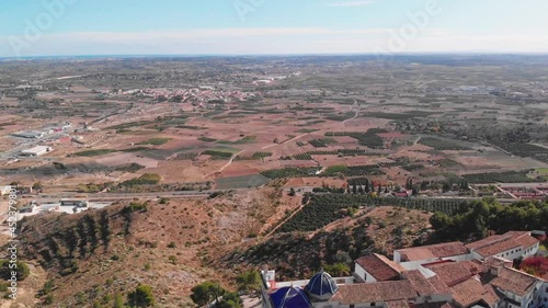 aerial drone footage of ancient spanish monastery tower in Valensia Spain, beautiful fields and mountains, tourism travel 4K 60 fps