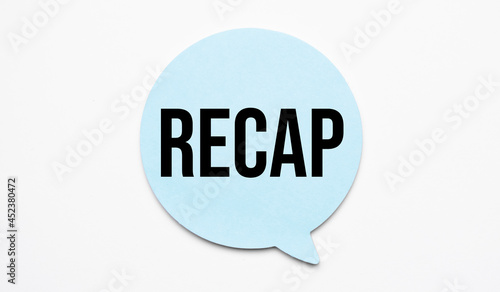 recap speech bubble and black magnifier isolated on the yellow background. photo