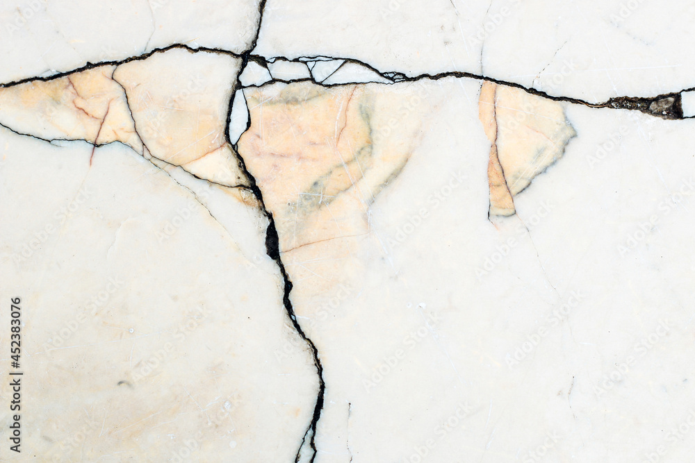 Obraz premium smooth marble wall texture with dark stripes and yellow stone inserts.