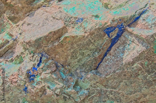 A bright blue Azurite vein runs through exposed rock near an old mining location.