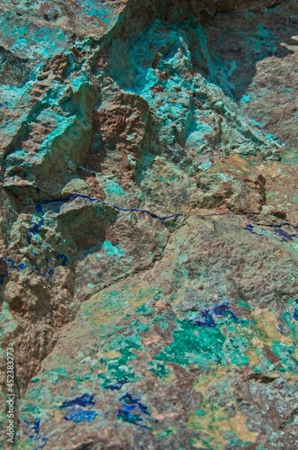 A bright blue Azurite vein runs through exposed rock near an old mining location.
