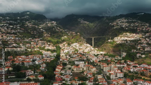 Wallpaper Mural Madeira Islands, Portugal. Beautiful valley within volcanic mountains as seen from above. Drone footage of sunrise over picturesque village in lush green island. High quality 4k footage Torontodigital.ca