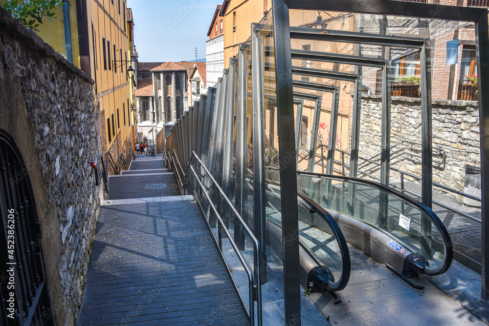 Fototapeta premium Vitoria-Gasteiz, Spain - 21 August, 2021: Urban escalators as public transport in old town Vitoria Gasteiz