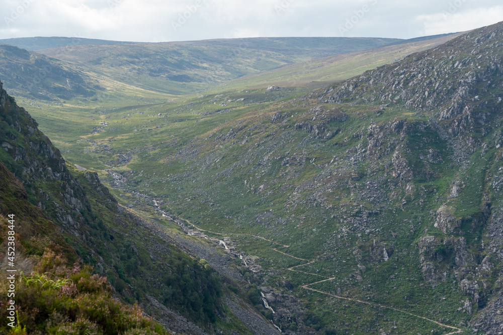 Naklejka premium Panoramic idyllic view of Glendalough Valley, County Wicklow Upper lake from miners way, Glenealo valley, Wicklow way, County Wicklow, Ireland.