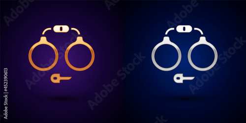 Gold and silver Handcuffs icon isolated on black background. Vector