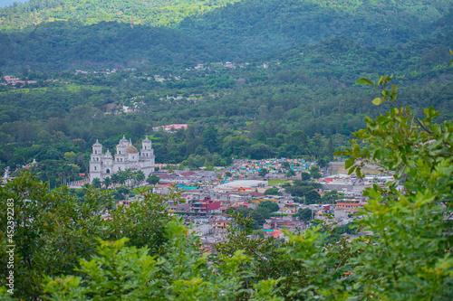 ciudad de Esquipulas con hermoso iglesia en medio con arboles  photo