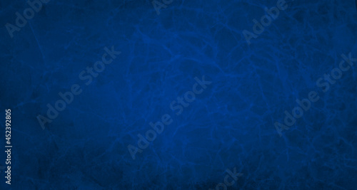 Blue background or paper design. Textured wrinkled crumpled grunge for product or website layouts. Elegant sapphire blue backdrop design.