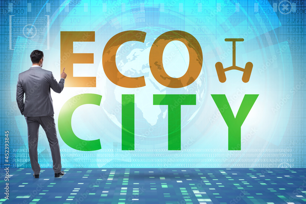 Eco city in ecology concept with businessman Eco city in ecology concept with businessman