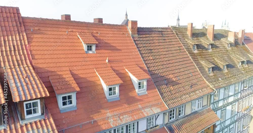 Aerial Upward Tilt Down Shot Of Medieval Structures In City On Sunny Day Against Clear Sky - Erfurt, Germany Aerial Upward Tilt Down Shot Of Medieval Structures In City On Sunny Day Against Clear Sky - Erfurt, Germany