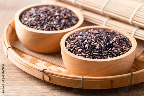 Purple glutinous rice grain in a wooden bowl, Thai rice