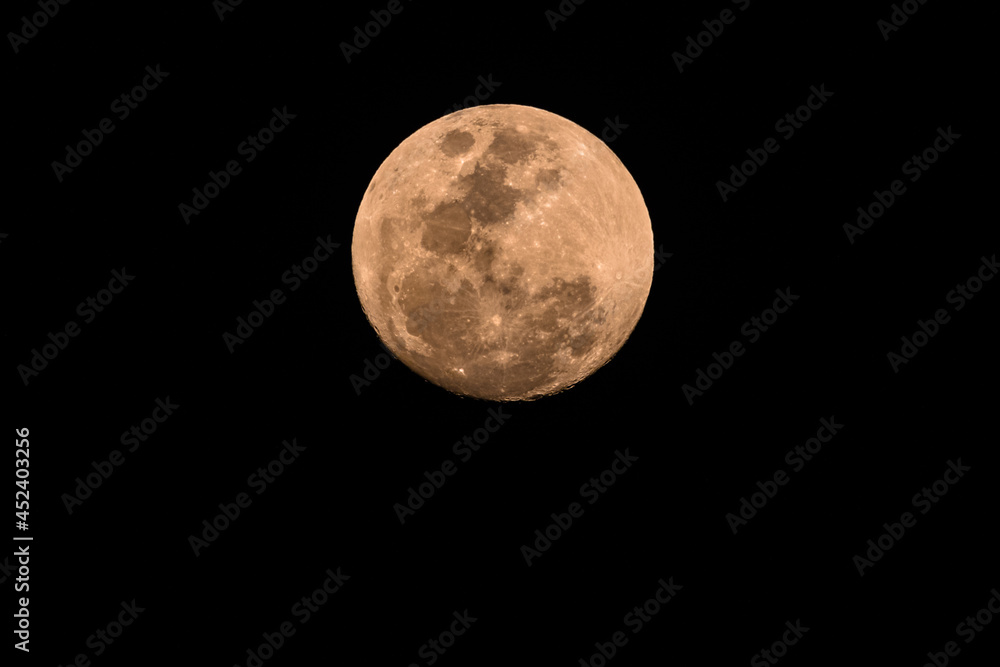 Ninety Nine Percent Full Moon in a hazy smoky night sky Ninety Nine Percent Full Moon in a hazy smoky night sky