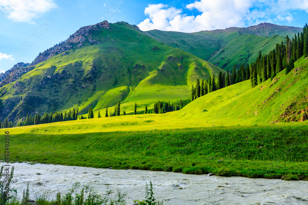 Beautiful mountain and green grassland in Xiata Scenic Area,Xinjiang,China.