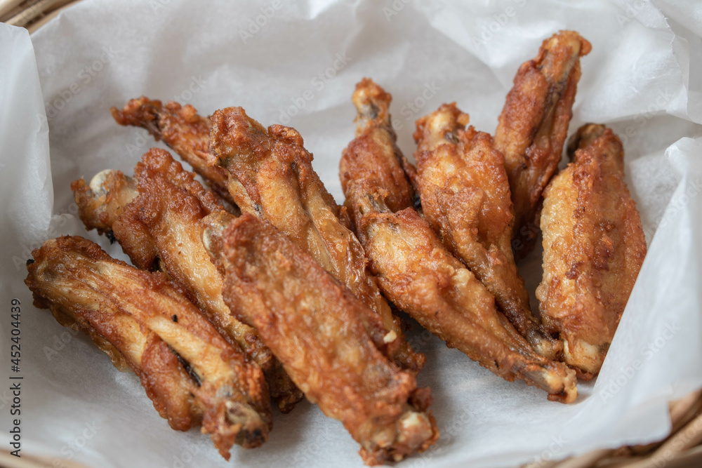 Crispy fried chicken wings in the basket.