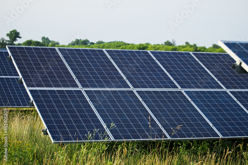 Solar panels fields on a green hills. 