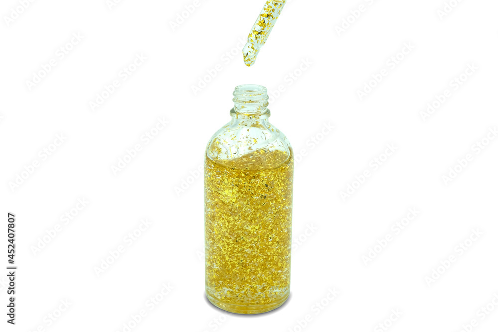 hands of a beautiful woman Dropping serum collagen moisturizer of face into clear yellow bottle soft light background. Protector skin Treatment facial essence oil hands of a beautiful woman Dropping serum collagen moisturizer of face into clear yellow bottle soft light background. Protector skin Treatment facial essence oil